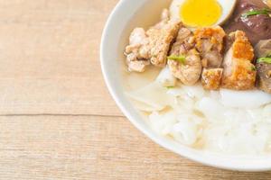 paste of rice flour or boiled Chinese pasta square in clear soup photo