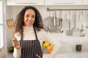 portrait Latin woman in kitchen photo