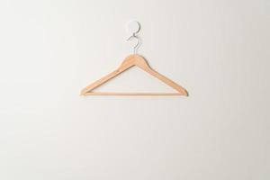 wood clothes hanger on wall photo