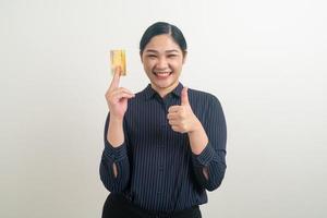 Asian woman holding credit card with white background photo