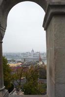 Budapest view with parliament house and river framed by a window from Fisherman's bastion photo