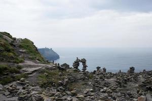 Beautiful  landscape at Moher, Ireland. Piles of little stones left by visitors. photo