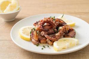 grilled octopus or squid with butter lemon sauce photo