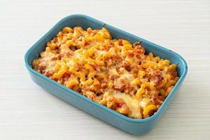 homemade macaroni bolognese with cheese photo