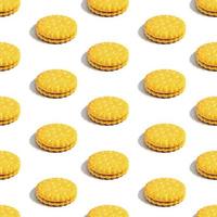 Seamless sandwich cookie pattern with creamy filling on a white background. Confectionery. photo
