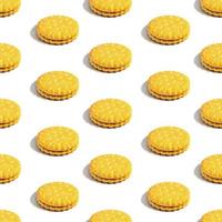 Seamless sandwich cookie pattern with creamy filling on a white background. Confectionery. photo