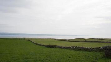 Beautiful green fields along the athlantic coast. Ireland photo