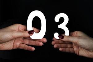 On the palms of the figure three and zero. photo