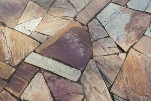 Sidewalk colored tiles with chips. photo