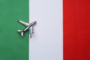 Flag of Italy and the plane. The concept of travel. photo