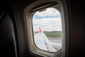 view from the airplane window of the airport during takeoff photo