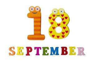 September 18 on white background, letters and numbers. photo