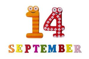 September 14 on white background, letters and numbers. photo