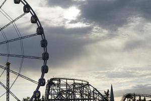 Big Ferris Wheel on clear blue sky background, close up photo