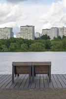 Wooden concrete bench in the Park. photo