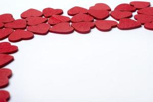 Red hearts on a white background. photo