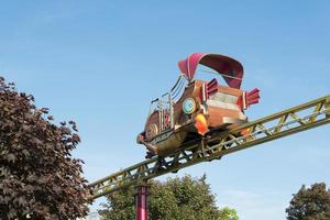Trailer in the amusement Park on the same rail. photo