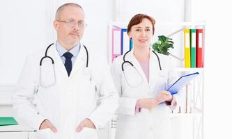 portrait doctors on medical office, male and female doctor photo