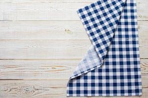 Checkered tablecloth on wooden table top view copy space photo