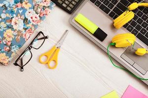 Creative workspace with work accessories and copy space on wooden table. Top view photo