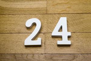Figure twenty-four on a wooden, parquet floor. photo