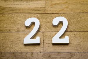 Figure twenty-two on a wooden, parquet floor.
