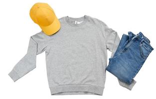 Grey pullover mock up isolation, yellow summer cap and blue denim - mockup isolation over white. Copy space photo