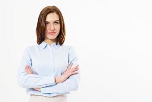 Young friendly successful brunette woman with crossed arms posing on a white background. Business woman with beautiful features. photo