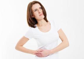 Young female woman having stomach ache isolated on white photo