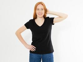 Beautiful red hair girl in a black t-shirt isolated on white. Pretty smile red head woman in tshirt mock up blank. photo