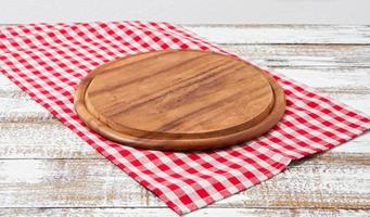 empty cutting desk and tablecloth on wooden table,copy space photo