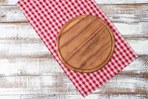 tablecloth and board for pizza on wooden desk closeup. Canvas, dish towels on white wooden table background top view mock up. Selective focus photo