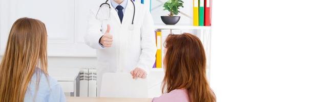 male doctor show one or like in medical office with patients,copy space,banner billboard photo