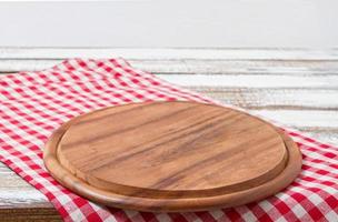 cutting desk on tablecloth, wooden table,mock up, food drinks, selective focus photo
