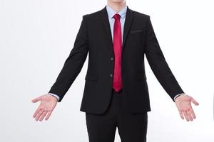 Businessman in black suit and open arms isolated on white background. Copy space and mock up. Business concept. photo