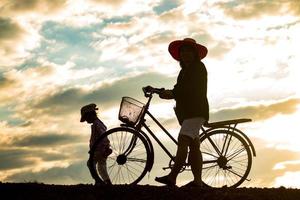 Mother and daughter in the countryside at sunset photo