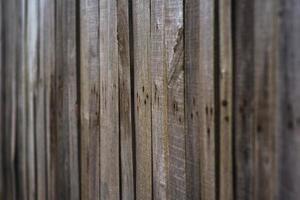 Fence of wooden, vertical slats. Texture. Close-up photo