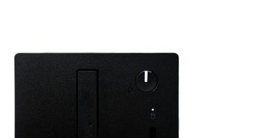 Black PC computer power button on white background photo