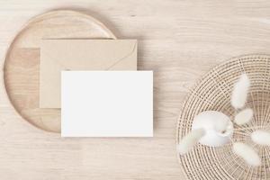 Blank paper cards, Greeting card Mockup with pampas grass on a wooden plate, beige background, Minimal beige workplace composition, flat lay, mockup photo