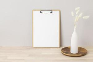 Home interior floral decor, pampas grass on table, Front view, clipboard, Greeting card Mockup. Beautiful white pampas grass in vase on white background photo