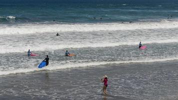 surfing on The Canteras beach in Gran Canaria, Canary islands photo