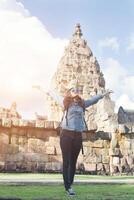 Young attractive woman enjoy life while traveling at phnom rung temple in thailand. photo