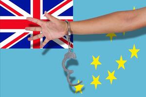handcuffs with hand on Tuvalu flag photo