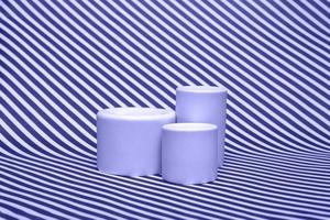 White podiums on an abstract background. Podium for cosmetics and various goods closeup photo