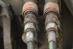 Rusty bolts and nuts of pipeline photo