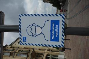 Brussels, Belgium, Aug 01, 2020 - Mandatory mask sign in Dutch photo