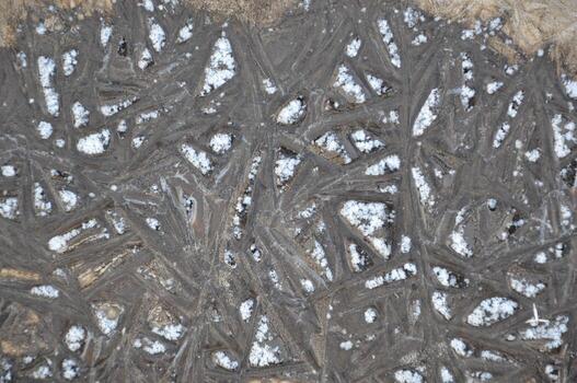 Ice texture on the ground winter patterns photo