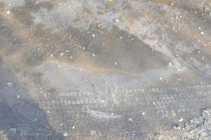 Ice texture on the ground winter patterns photo