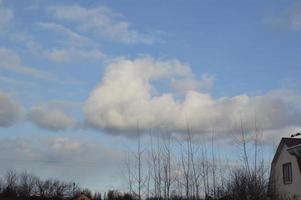 Clouds on the blue sky in winter photo