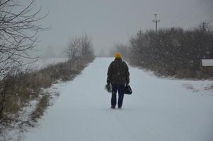 Forest frozen road with ice and snow photo